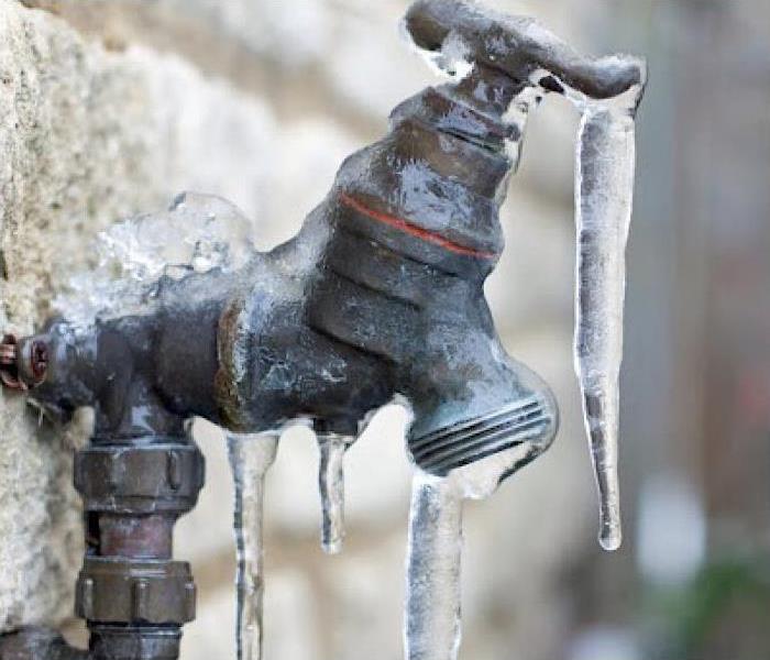Ice dripping off a pipe and faucet. 