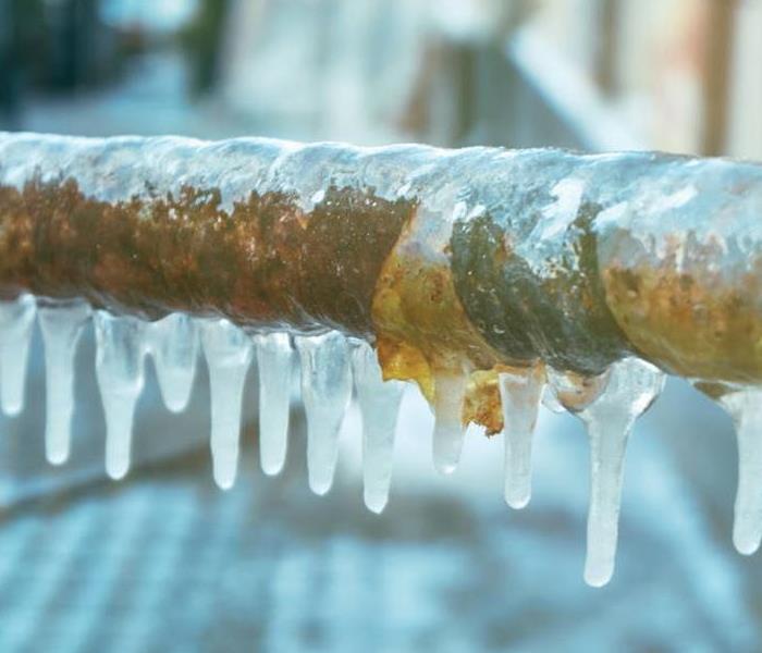Pipe with ice and snow on it.